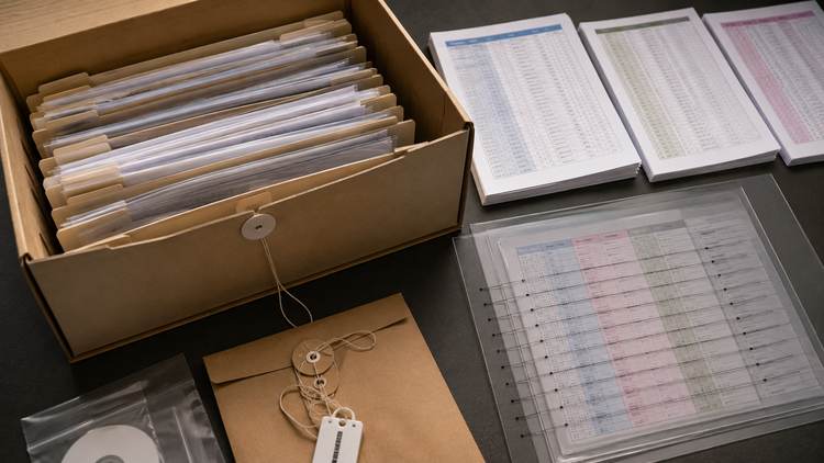 Preserved carrier source records beside documented normalization materials.